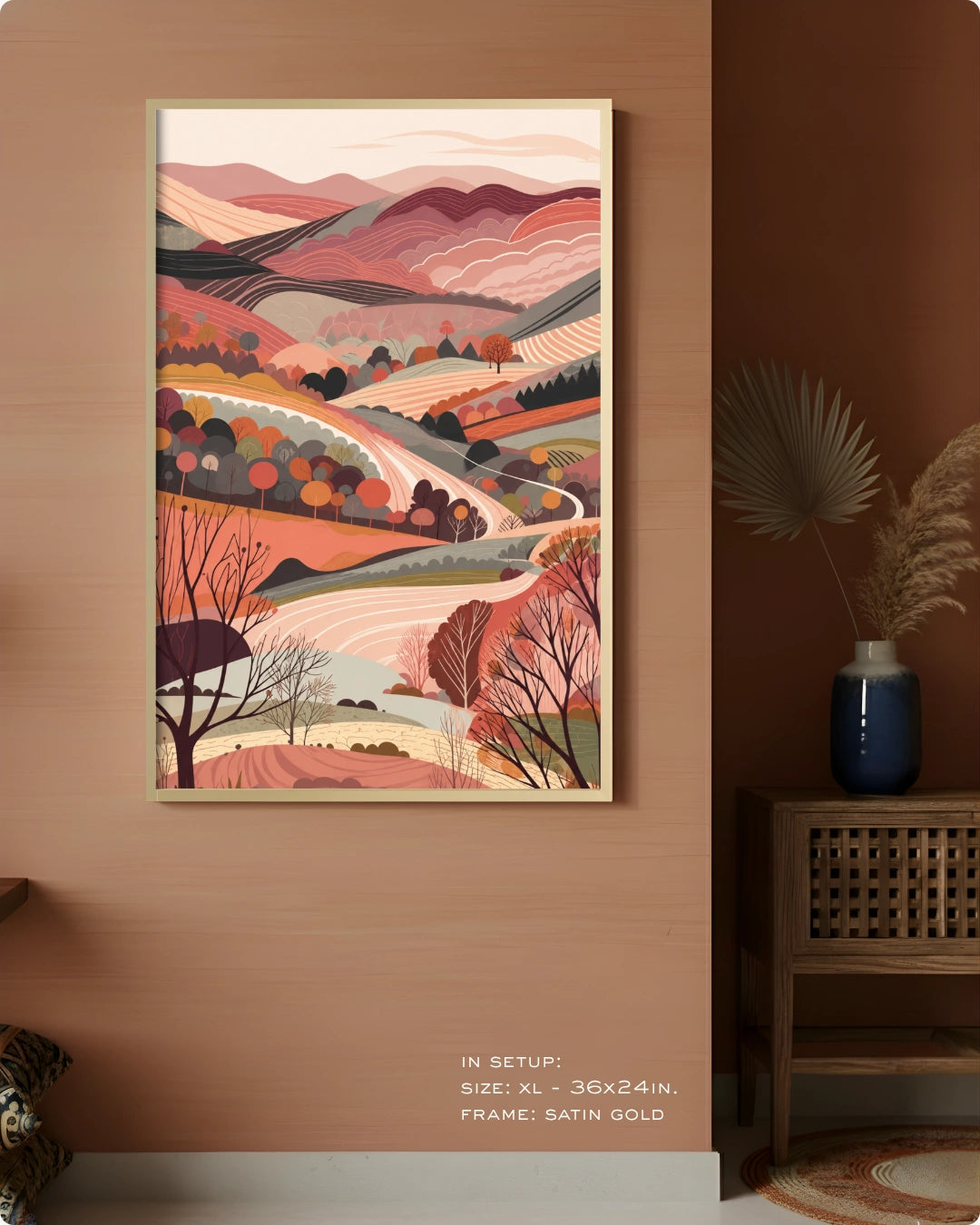 Visual size guide mockup for the Terra 3 landscape wall art in Extra Large size with a Satin Gold frame displayed over a woven cabinet against a terracotta wall.