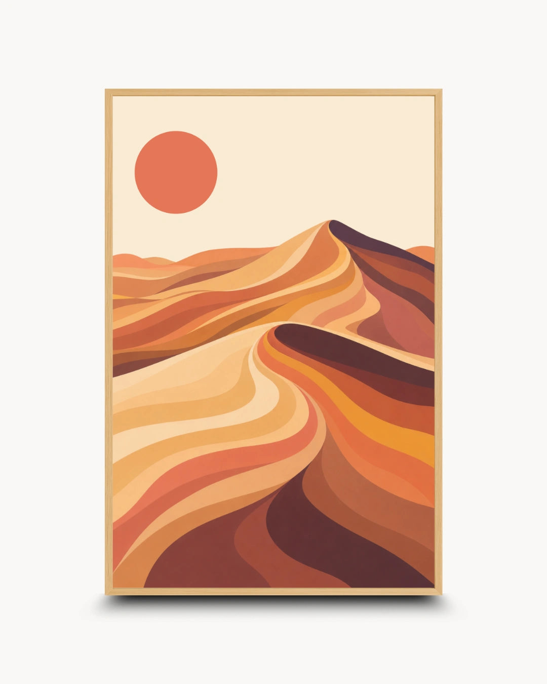 A framed art print featuring a stylized desert landscape with layered sand dunes in warm orange, brown, and beige tones under a solid orange sun, shown on a light gray background.