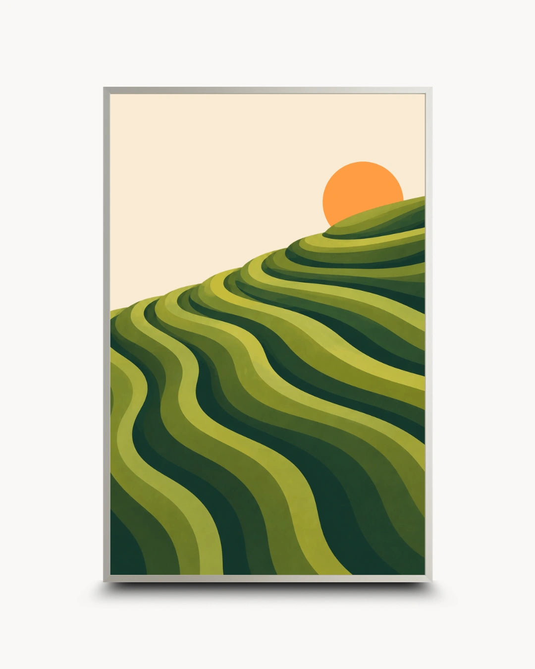 A framed art print featuring a stylized landscape of green terraced hills under a pale cream sky and a bright orange sun, shown against a light gray background.