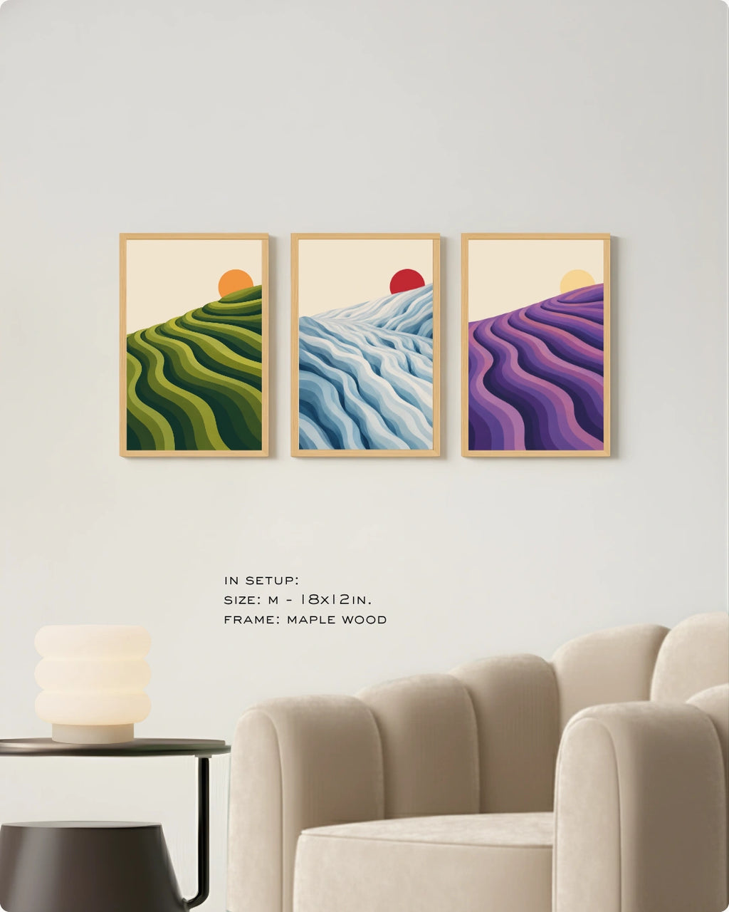 Lifestyle mockup of the 3 piece canvas art landscape in black frames styled above a sleek white media console in a bright room.