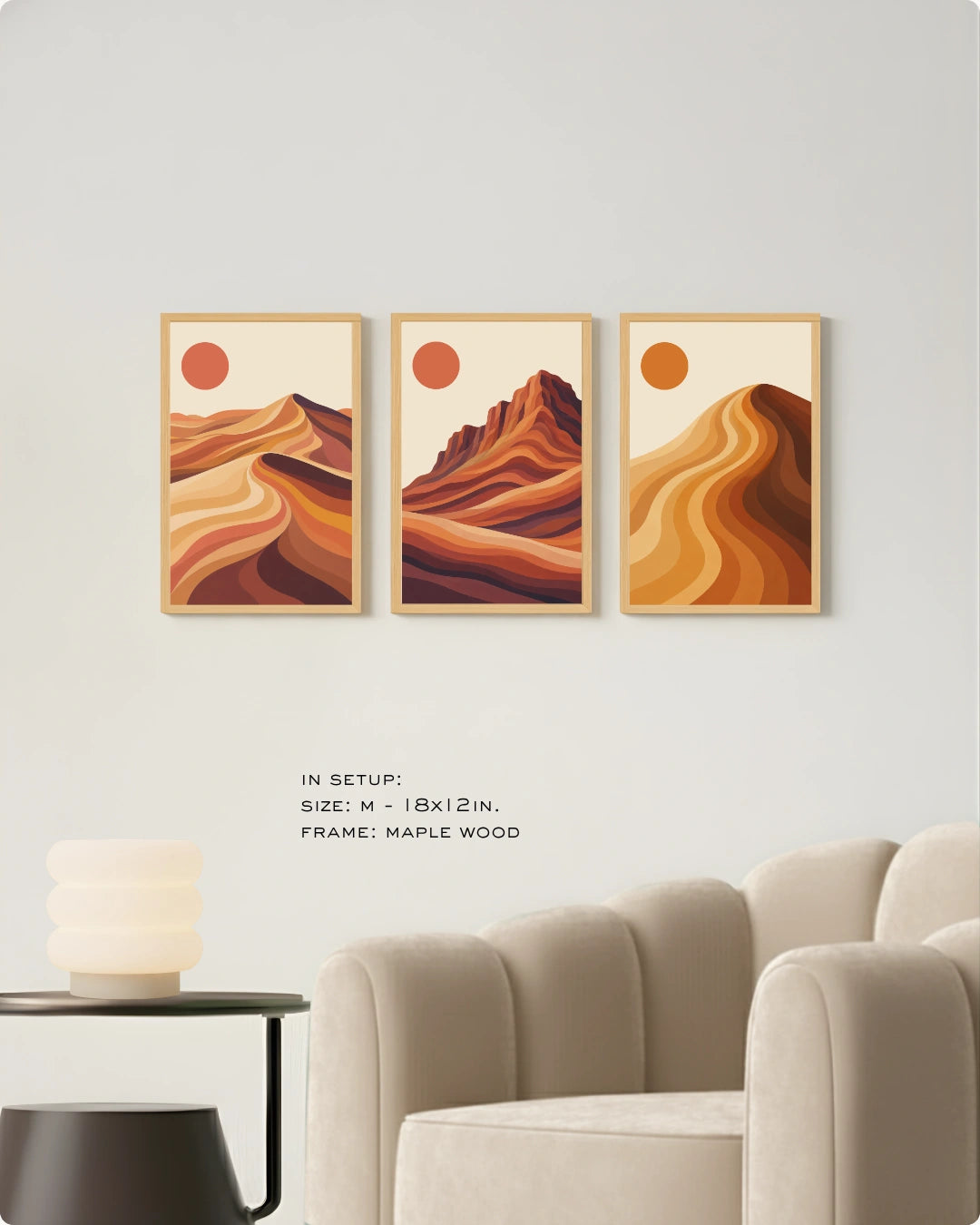 Visual size guide mockup for the 3 piece canvas art landscape in Medium size with gold frames displayed over a minimalist ribbed sofa.