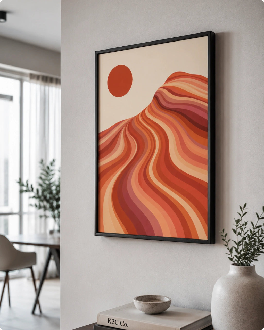 Lifestyle mockup of the southwestern desert wall decor in a black frame styled above a light wooden sideboard in a modern room.