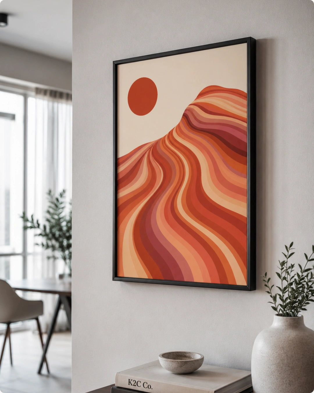 Lifestyle mockup of the southwestern desert wall decor in a black frame styled above a light wooden sideboard in a modern room.