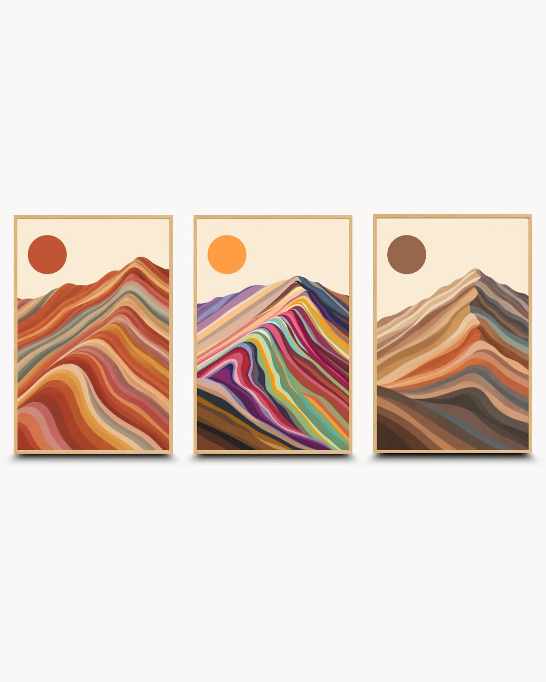 A set of three framed abstract mountain art prints with colorful layered wave patterns and sun motifs, displayed side-by-side on a light gray background.