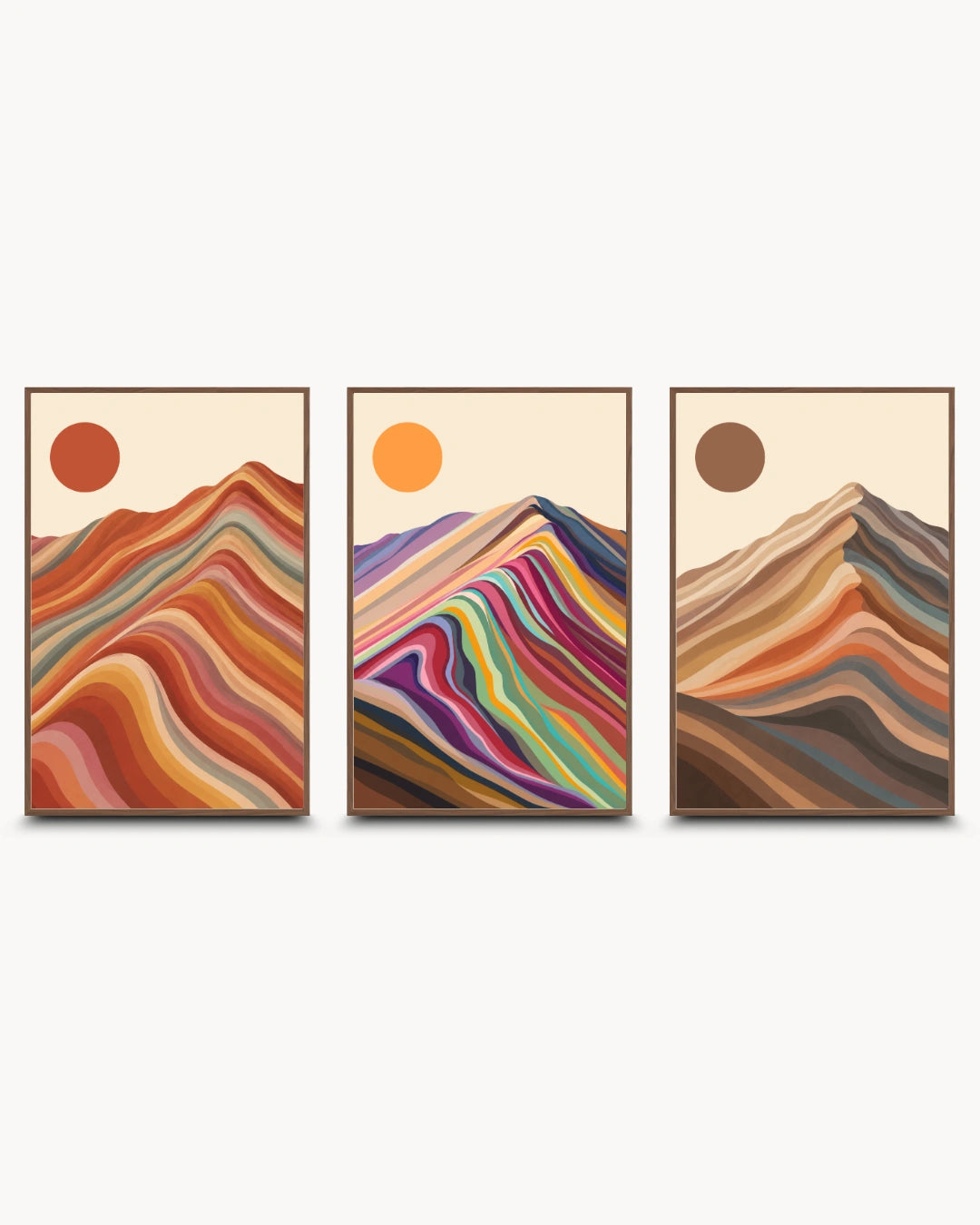 A set of three framed abstract mountain art prints with colorful layered wave patterns and sun motifs, displayed side-by-side on a light gray background.