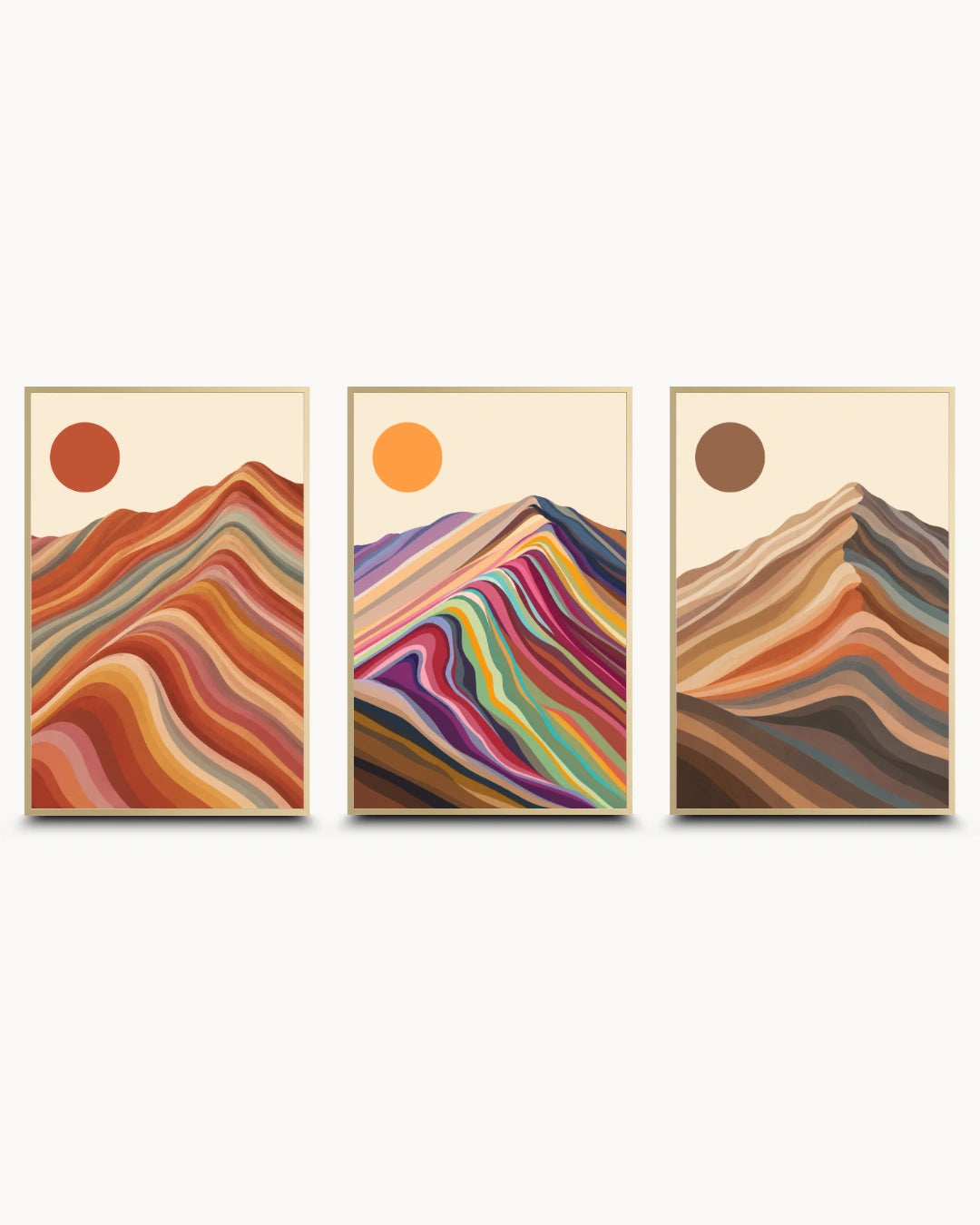 A set of three framed abstract mountain art prints with colorful layered wave patterns and sun motifs, displayed side-by-side on a light gray background.
