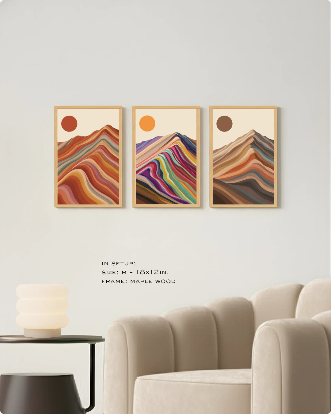 Visual size guide mockup for the scandinavian style landscape prints in Large size with gold frames displayed over a minimalist ribbed sofa.