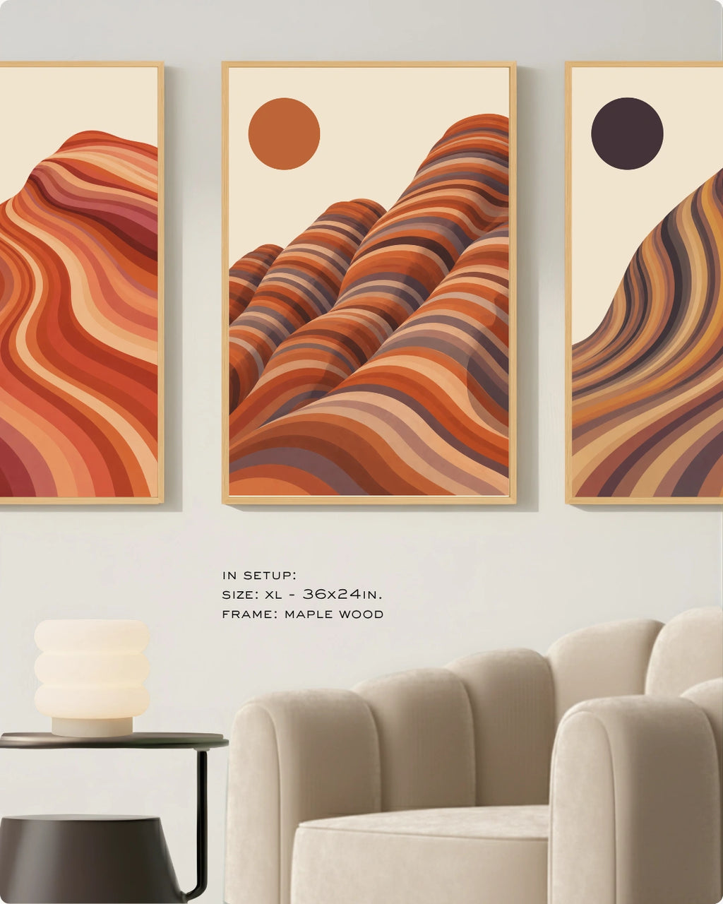 Three framed abstract desert landscape wall art prints hang above a light beige sofa in a modern living room. The prints feature layered wavy rock formations in warm orange, rust, brown, and cream tones, with minimalist sun circles.