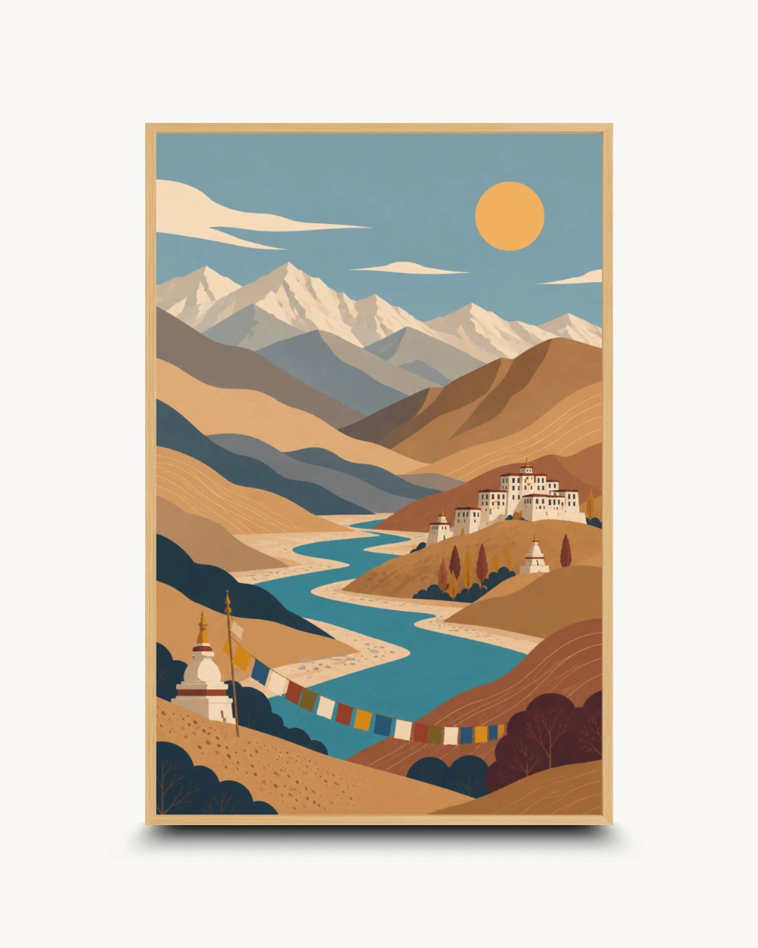 A vertical art print featuring a stylized illustration of a mountain landscape with snow-capped peaks, a winding blue river, tan and brown hills, a yellow sun, and small white buildings with prayer flags, shown against a light gray background.