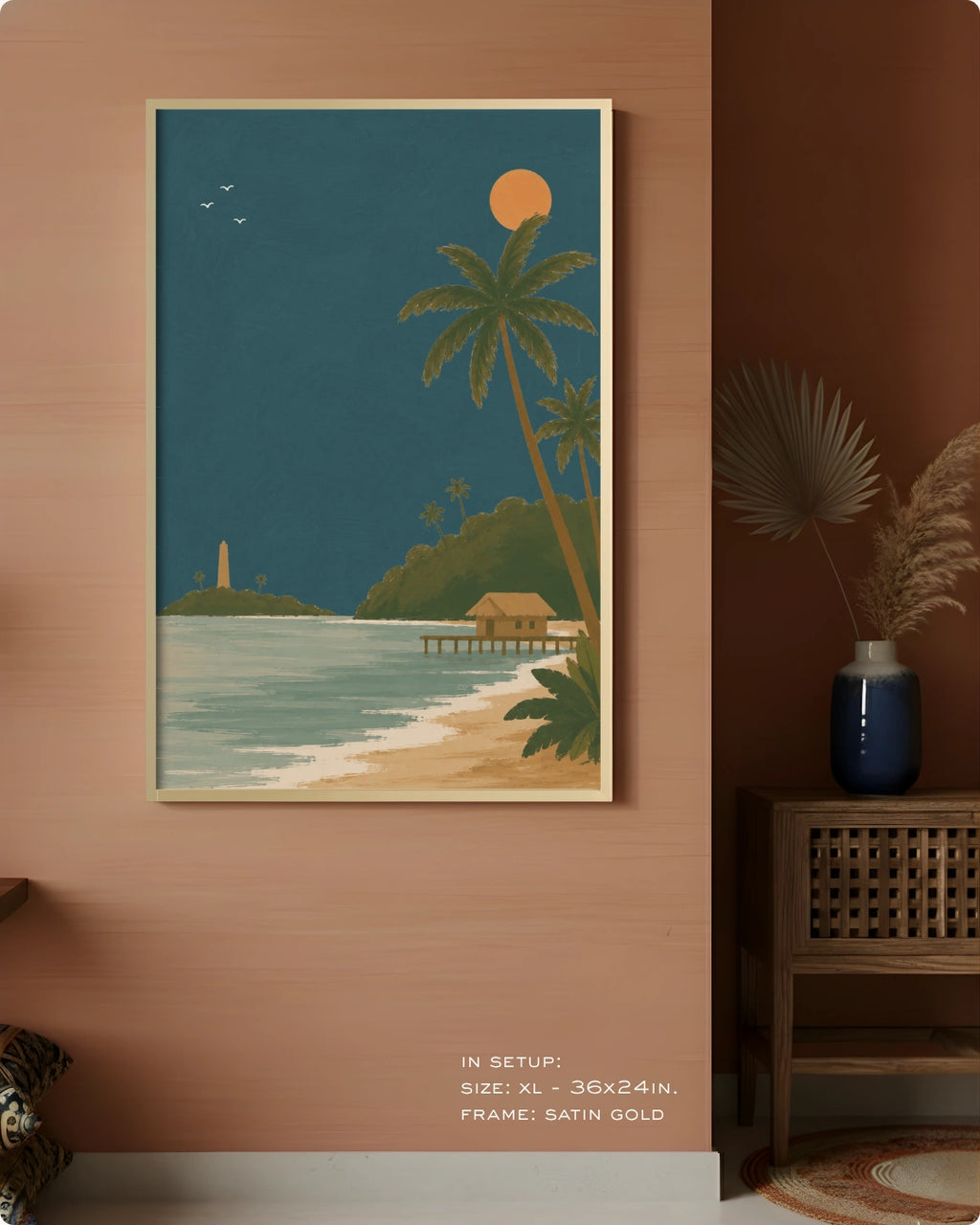 A framed tropical beach art print hangs on a warm terracotta wall in a styled interior. The artwork shows palm trees, a sandy shore, turquoise water, and a dark teal sky with a yellow sun.