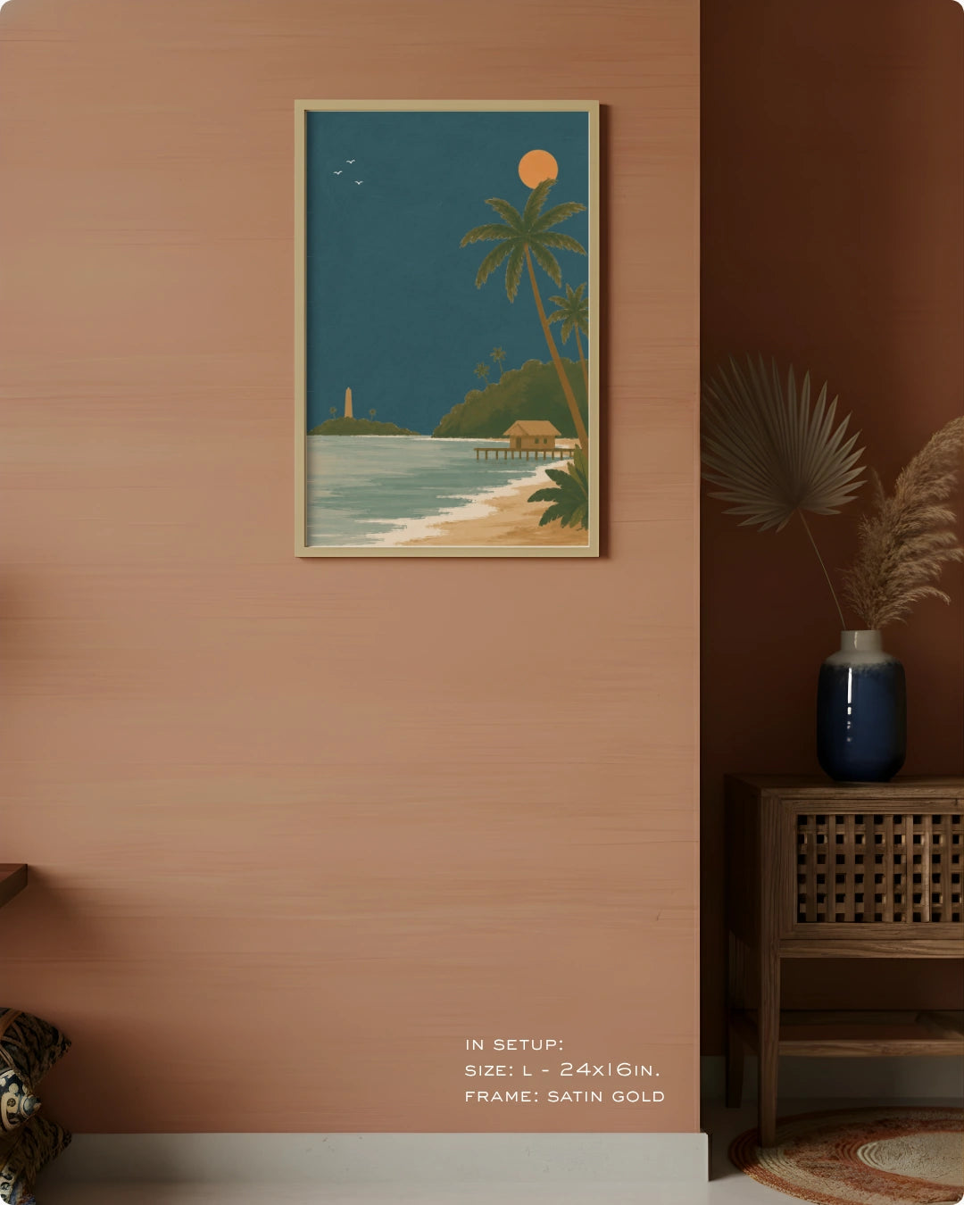 A framed art print featuring a tropical beach scene with palm trees, a lighthouse, and a pier, displayed on a textured terracotta wall in a styled interior setting.