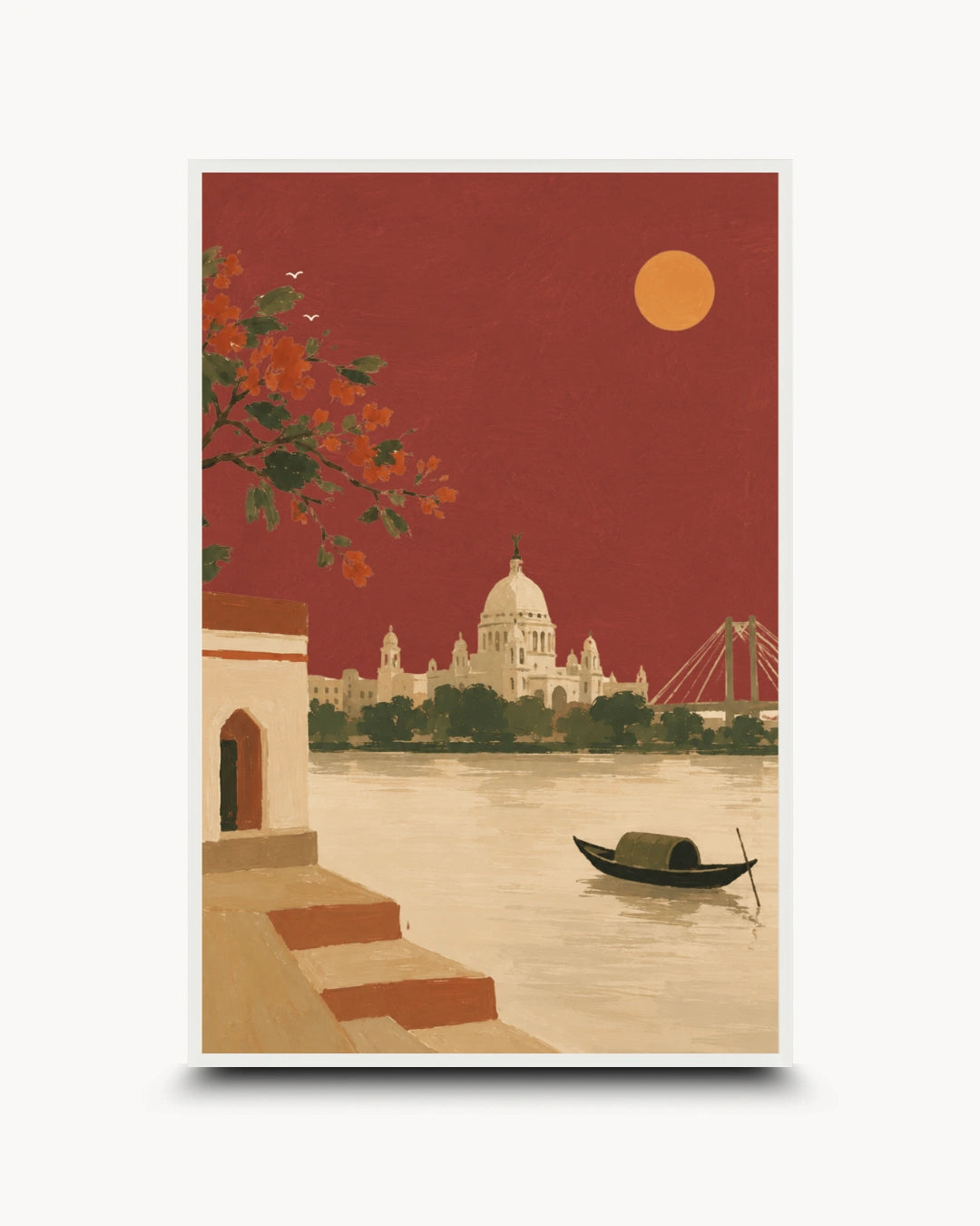 A framed art print depicting a scenic Indian river landscape with a domed cathedral, a small boat on the water, and a red sky with a yellow sun, shown against a light gray background.