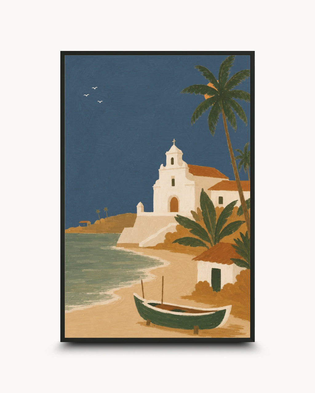 A framed travel-style art print depicting a tropical beach scene with a white church, palm trees, a small boat on the sand, and a deep blue sky, shown against a light gray background.