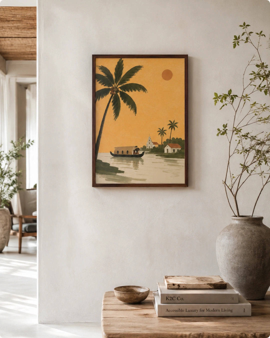 A framed art print featuring a retro-style tropical scene with palm trees, a boat, and a warm yellow-orange sky, displayed on a white wall above a wooden console table with books and a vase.