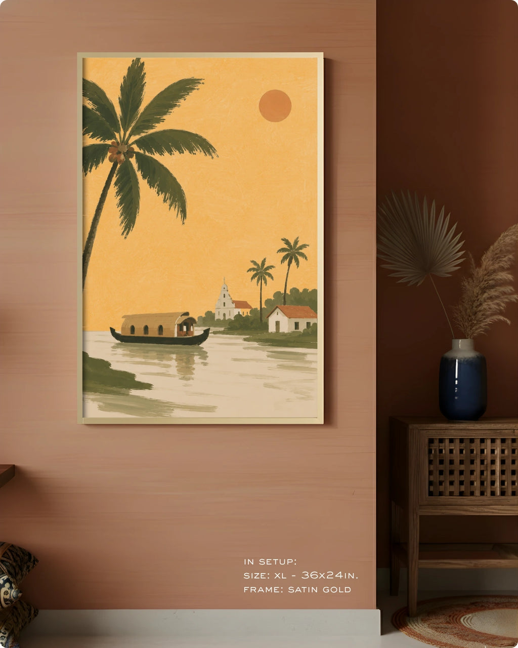 A framed art print featuring a retro-style tropical landscape with palm trees, a houseboat, and a small church under a warm orange sky, displayed on a terracotta-colored wall in a styled interior setting.