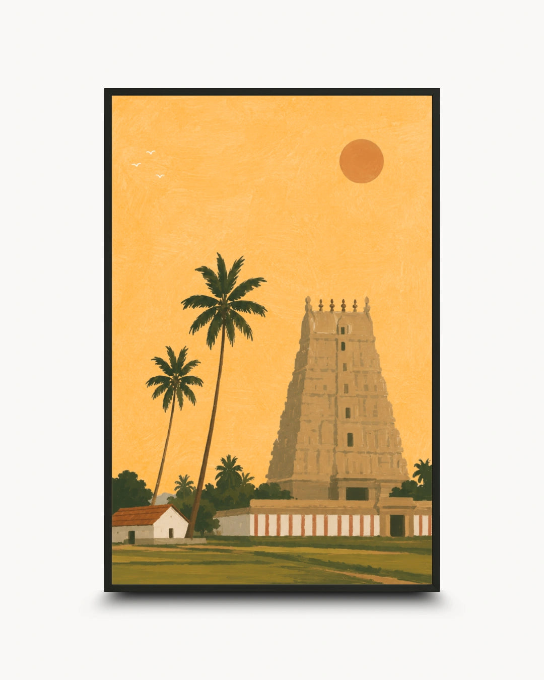 A framed art print featuring a stylized illustration of a South Indian temple tower, palm trees, a small house, and a sun against a warm golden-yellow sky, shown on a light gray background.