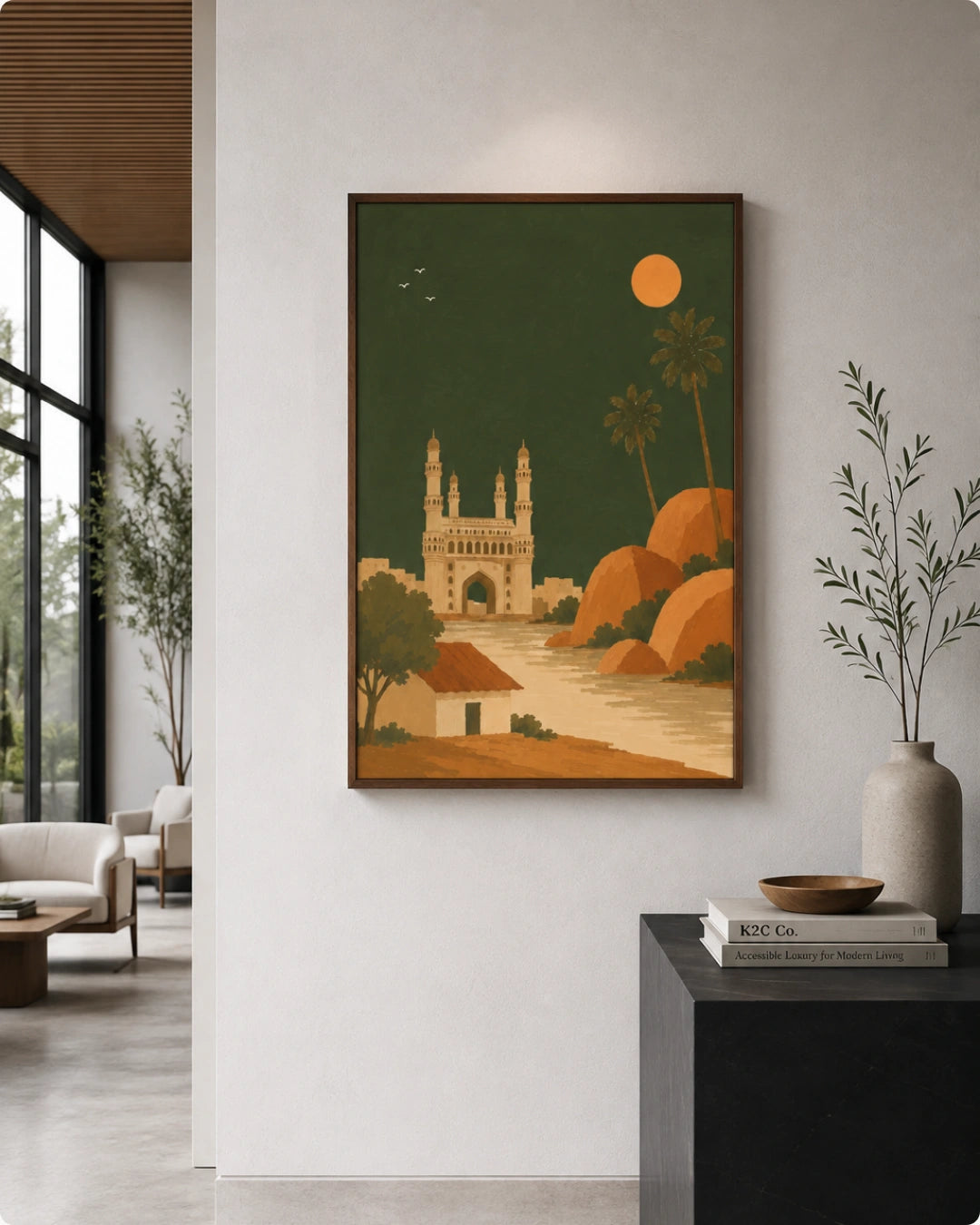 A framed art print featuring a stylized illustration of the Charminar in Cairo under a full moon, displayed on a light gray wall in a modern living room setting.