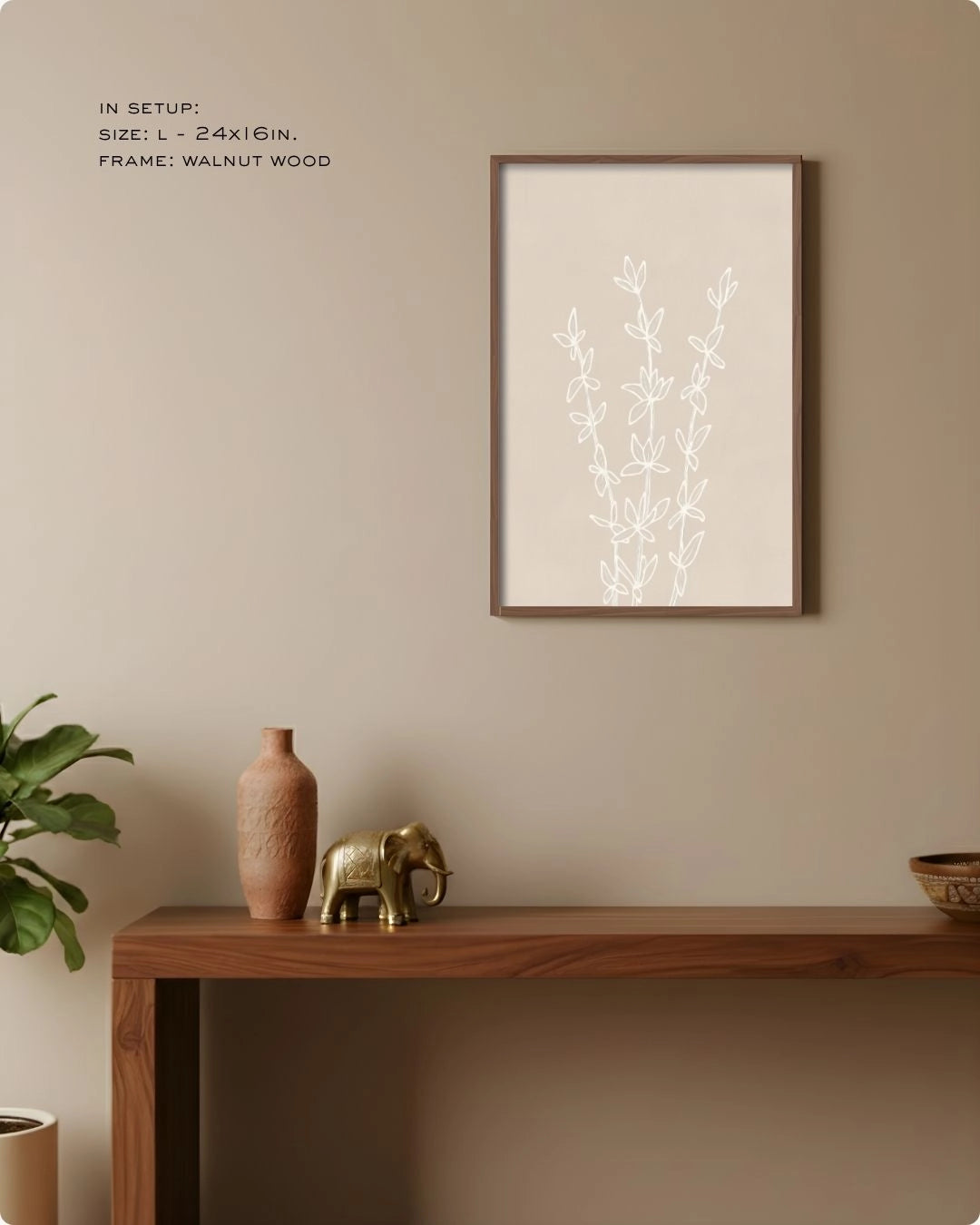 K2C Co. Essence botanical line drawing in a Noir Black frame, featured in a warm minimalist home setup above a wooden entryway table with natural accents.