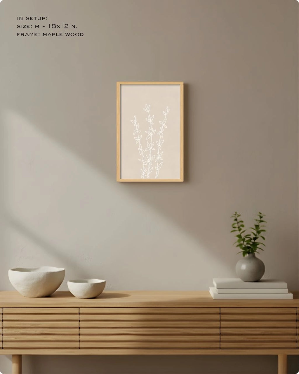 Medium (Size M) Essence botanical line art in a natural Maple Wood frame by K2C Co., featured in a minimalist Japandi living room mockup to demonstrate medium-scale wall decor.