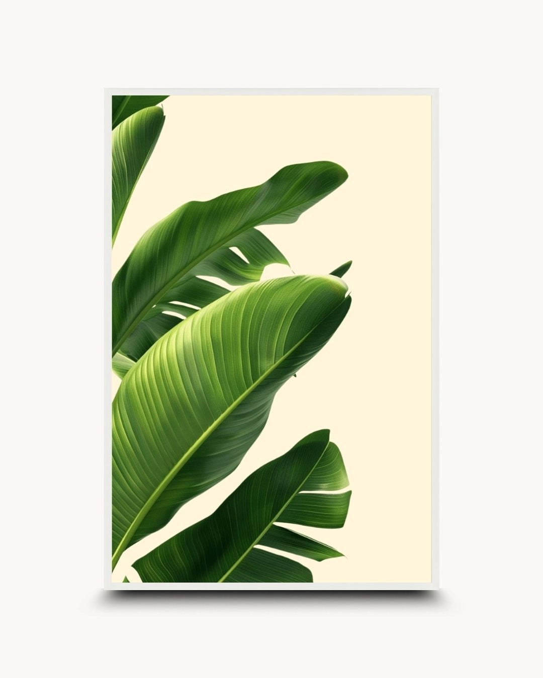 K2C Co. tropical banana leaf artwork in a Moon White frame. A clean, minimalist botanical print on a neutral background, perfect for a bright Japandi-style bedroom or office.