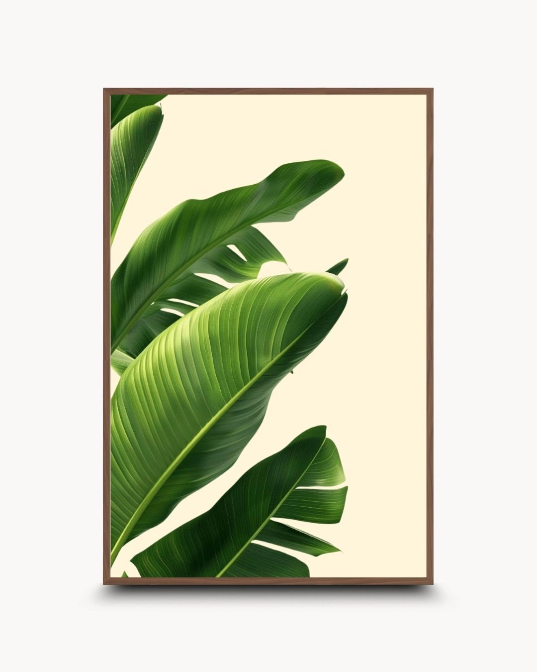 Japandi style botanical wall art featuring green tropical leaves in a warm Walnut Wood frame by K2C Co. Minimalist nature-inspired artwork for a sophisticated modern living room.