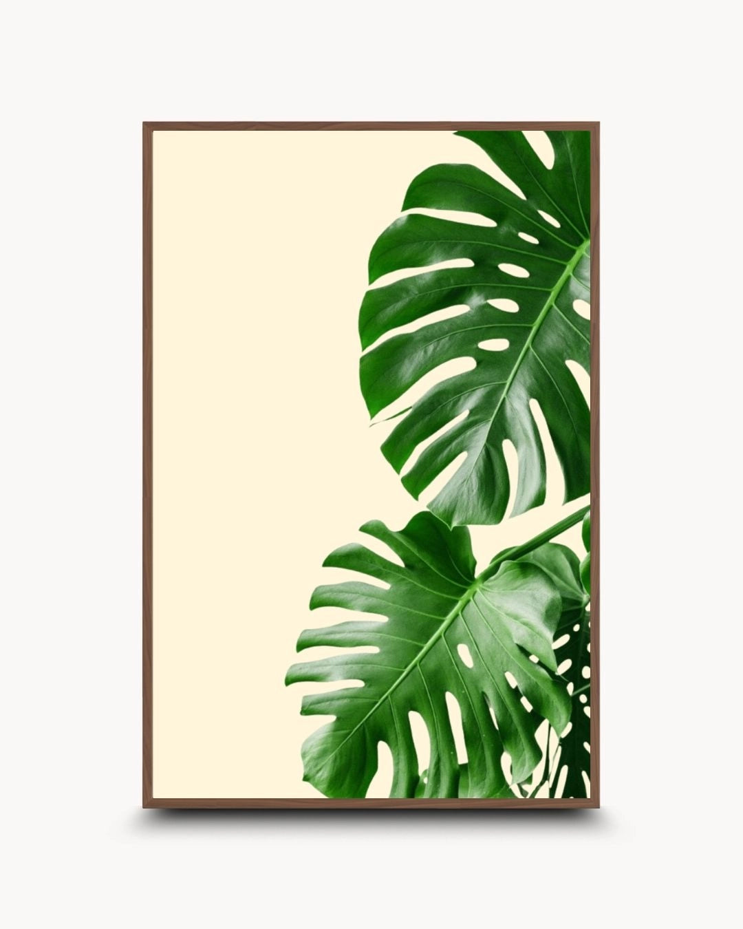 Japandi style botanical wall art featuring green Monstera leaves in a warm Walnut Wood frame by K2C Co. Minimalist nature-inspired artwork for a sophisticated modern dining area.