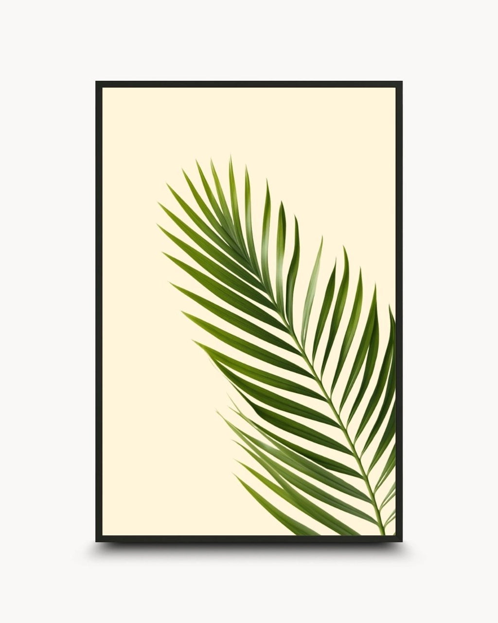 Minimalist botanical palm leaf artwork by K2C Co. featuring a single green tropical frond on a cream background, set in a Noir Black frame. Ideal for modern Scandinavian home decor.