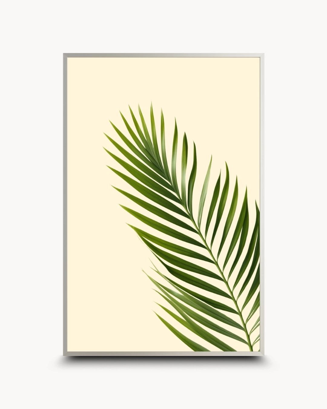 Modern minimalist tropical palm leaf botanical artwork by K2C Co. in a sleek Satin Silver frame. Clean green palm frond design on a neutral background, ideal for contemporary urban home styling.