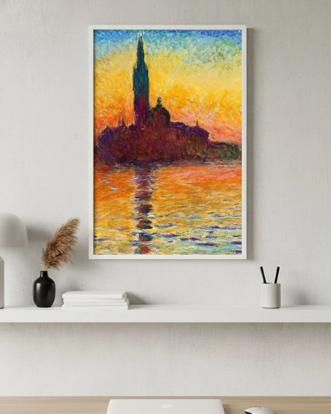 Claude Monet's San Giorgio Maggiore at Dusk in a 0.5-inch Moon White frame, styled above a white minimalist desk with pampas grass for a warm, bright home office.