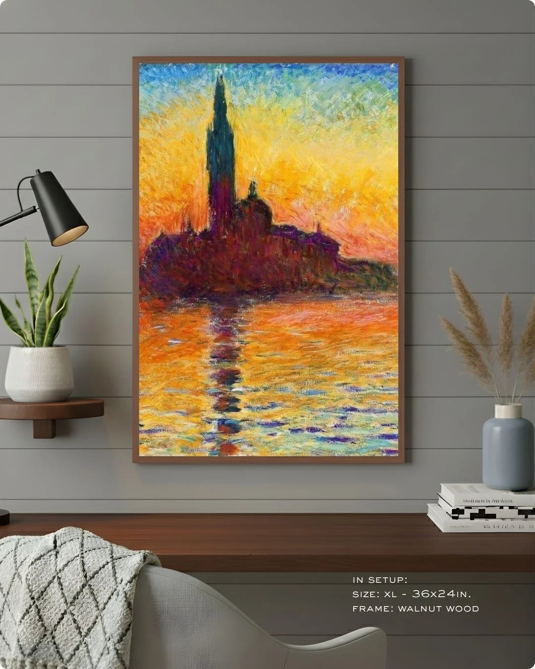 Monet's San Giorgio Maggiore at Dusk in a warm Walnut Wood frame by K2C Co., styled against a grey wood-paneled wall with a black desk lamp and indoor plants.