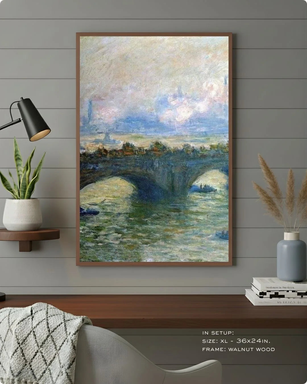 Monet's Waterloo Bridge in a warm Walnut Wood frame by K2C Co., styled against a grey wood-paneled wall with a black desk lamp and organic textures.