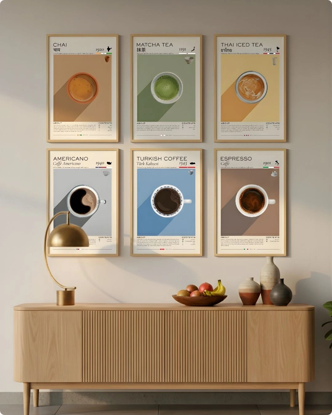 A curated 6-piece global beverage infographic gallery wall set by K2C Co. in warm Walnut Wood frames, styled above a flatted light wood sideboard with a gold lamp and organic decor.