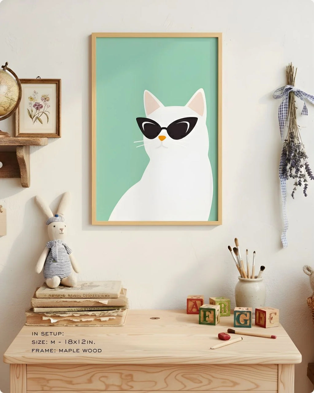 Close-up of the "Cool Cat" illustration in a Maple Wood frame, styled on a child's light wood desk with art supplies.