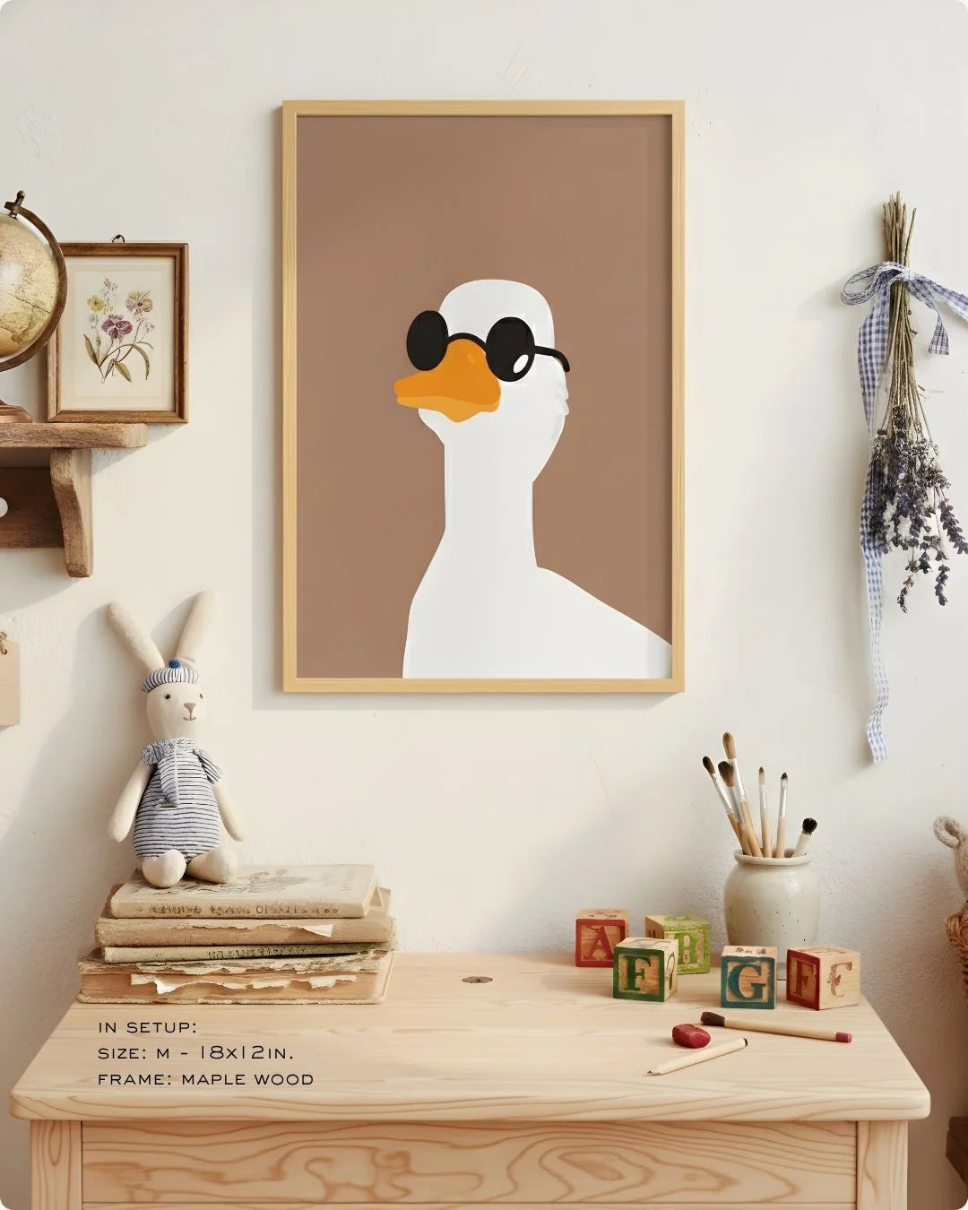 Close-up of the "Cool Duck" illustration in a Maple Wood frame, styled on a child's light wood desk with art supplies.