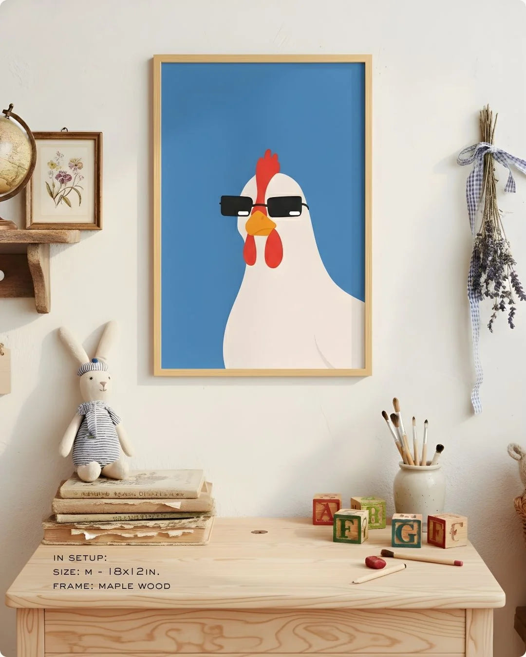 Close-up of the "Cool Hen" illustration in a Maple Wood frame, styled on a child's light wood desk with art supplies.