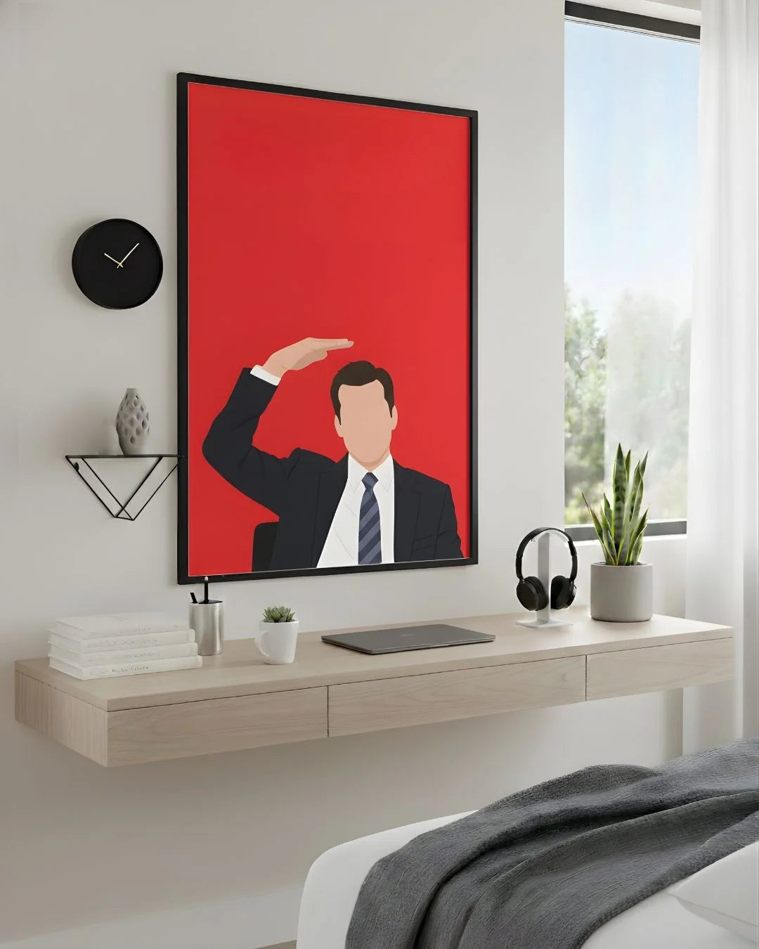 Minimalist Harvey Specter "Suits" print in an XL Noir Black frame (24x36in) styled above a light wood floating desk in a modern bedroom-office.