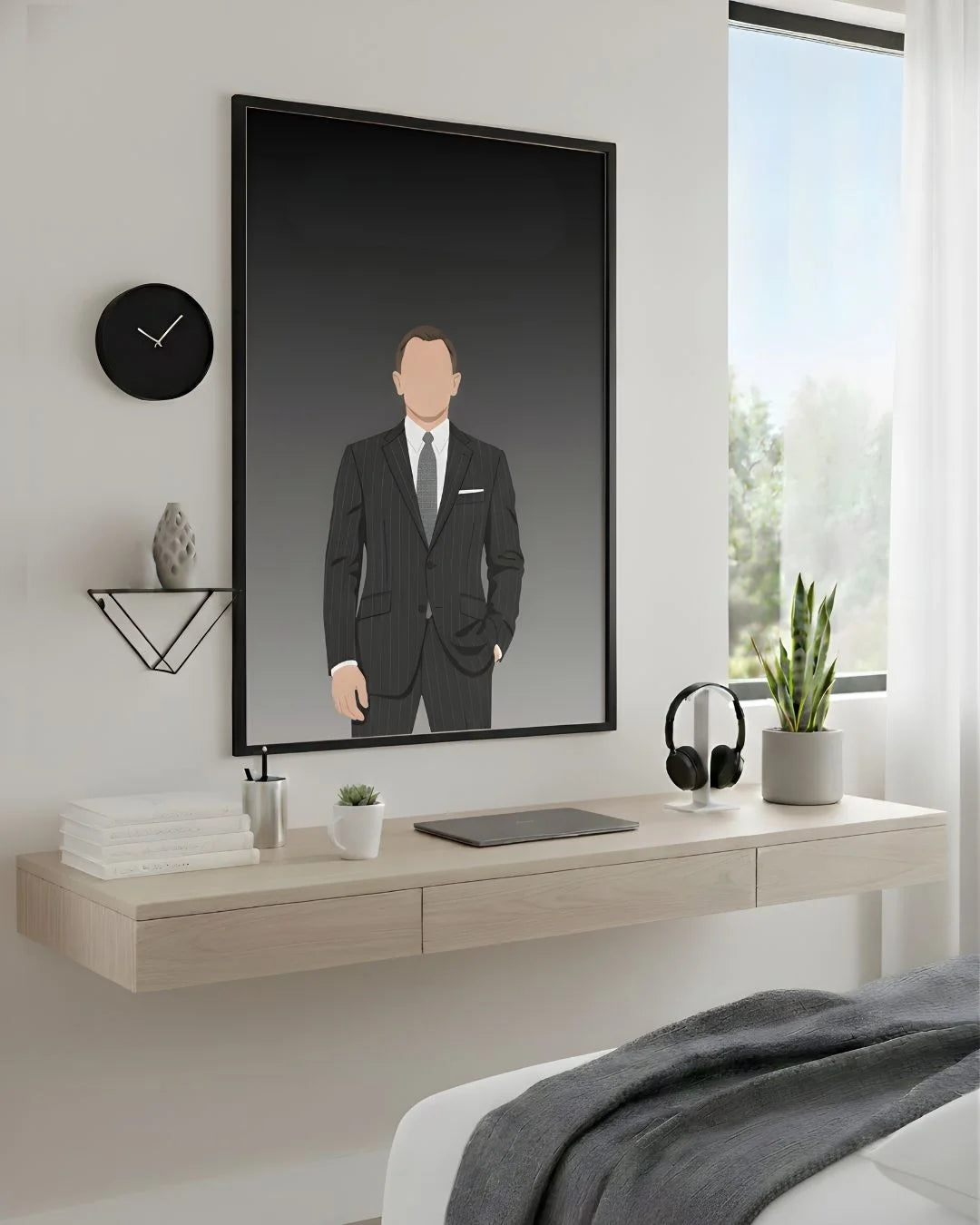 Minimalist James Bond 007 print in an XL Noir Black frame (24x36in) styled above a light wood floating desk in a modern bedroom-office.