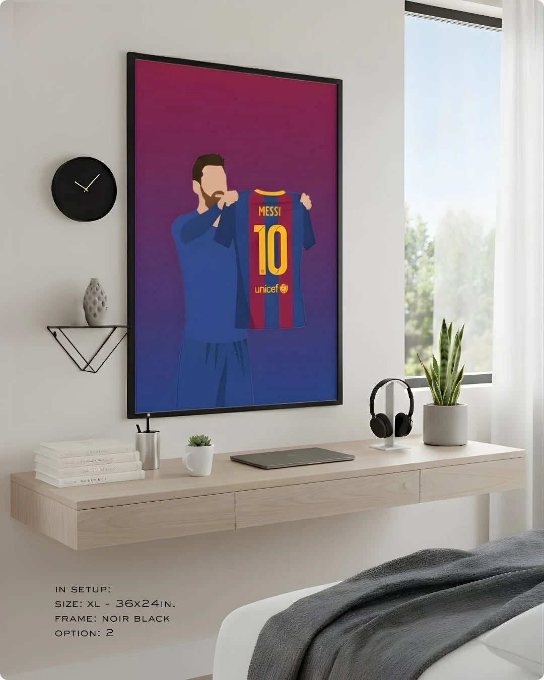 Minimalist Lionel Messi Barcelona celebration print in an XL Noir Black frame (24x36in) styled above a light wood floating desk in a modern bedroom-office.