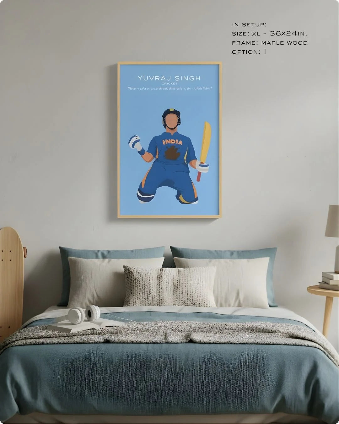 Yuvraj Singh art print in a natural Maple Wood frame, styled as a focal point above a bed in a serene blue bedroom.