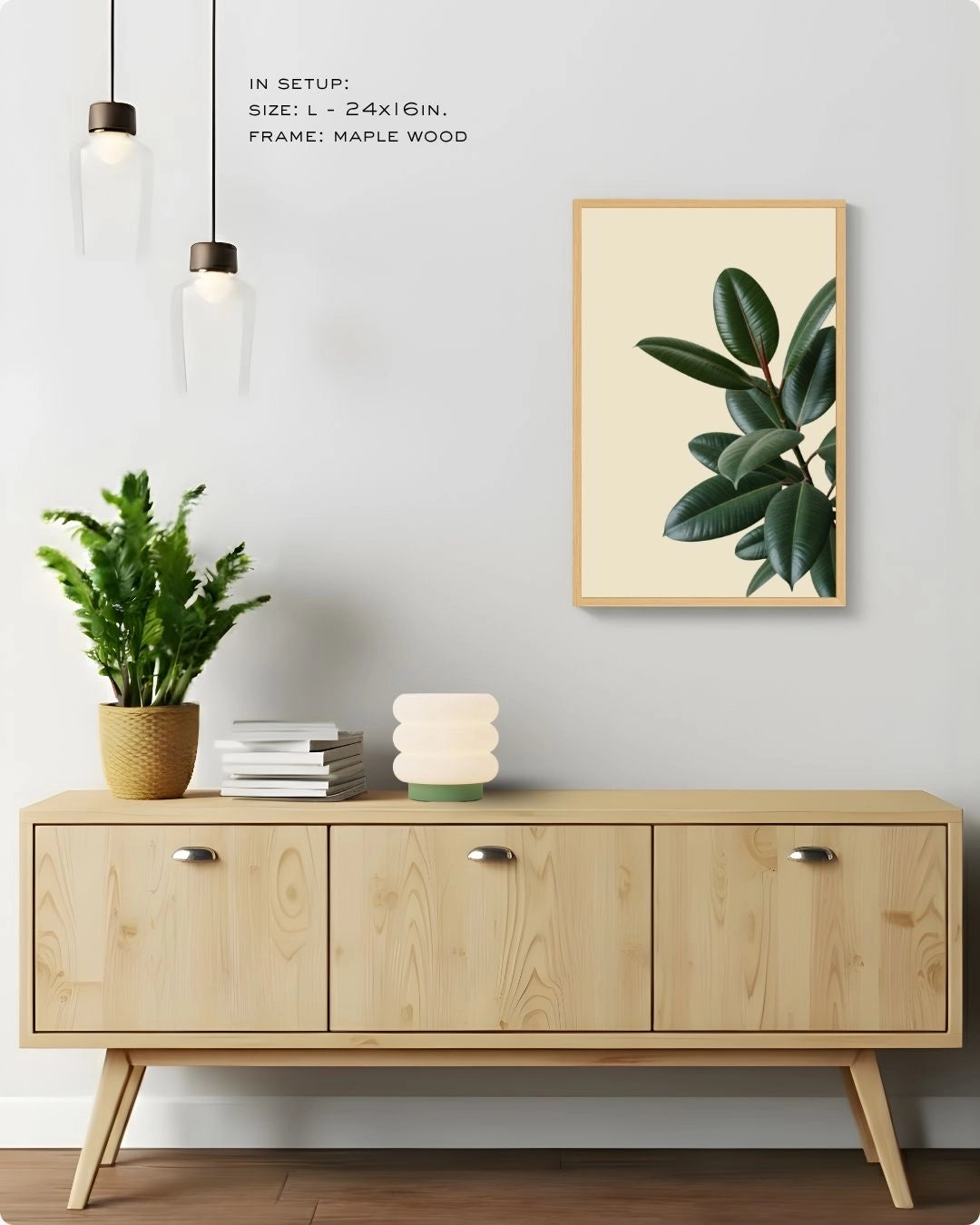 Minimalist Fiddle Leaf Fig wall art by K2C Co. in a Maple Wood frame (Size L), styled in a bright Japandi home mockup above a wooden sideboard with pendant lighting.