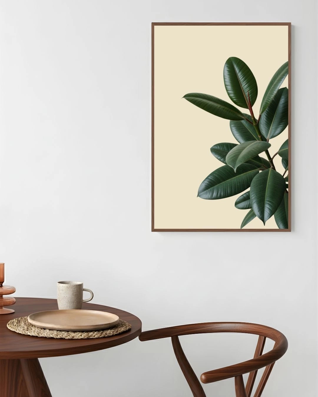 Minimalist rubber plant wall art by K2C Co. in a Walnut Wood frame, styled in a warm Japandi dining room with a round wooden table.