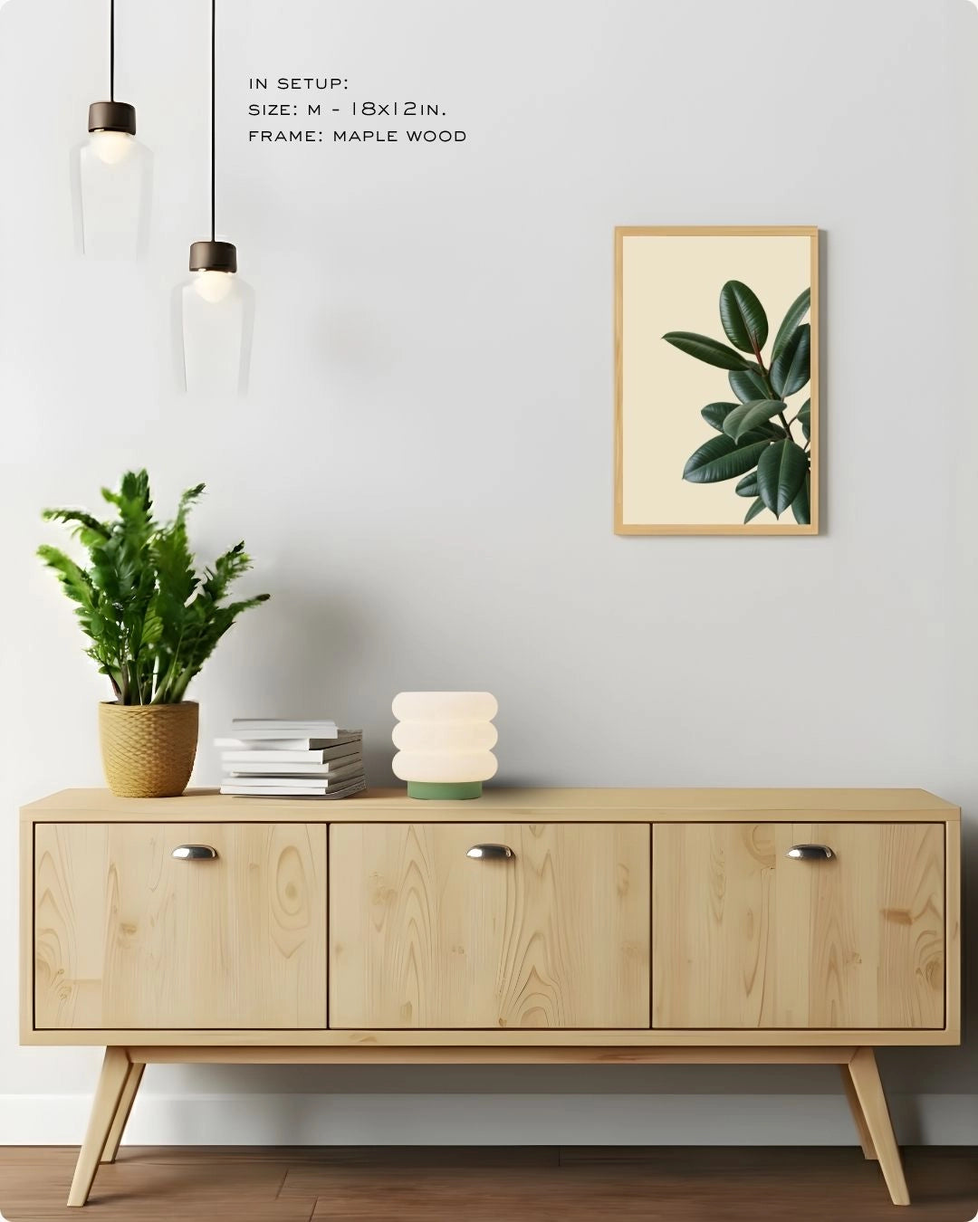 Medium-sized (Size M) Fiddle Leaf Fig botanical print by K2C Co. in a Maple Wood frame, displayed in a clean living room setting to showcase versatile wall decor scaling.