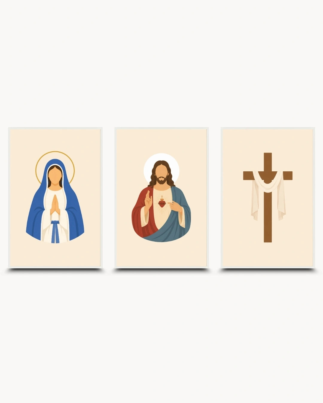 A three-panel wall art set featuring stylized religious illustrations: the Virgin Mary on the left in blue and white with a gold halo, Jesus Christ in the center in red and blue with a white heart and halo, and a brown Christian cross with white draped cloth on the right, all on cream backgrounds.