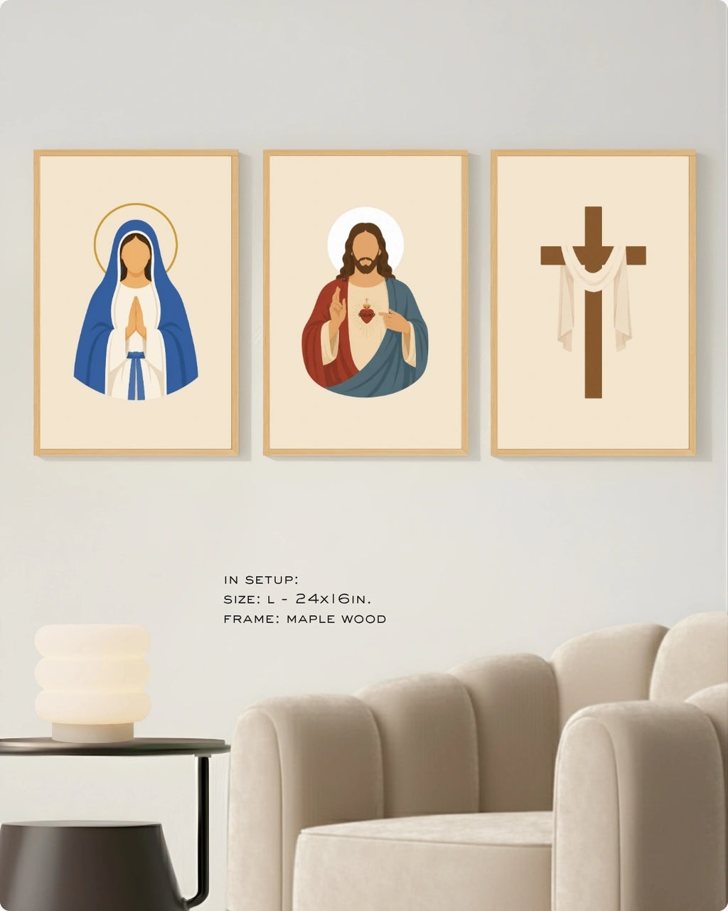 Three framed religious wall art prints displayed above a sofa in a living room setting. The left print shows the Virgin Mary in blue and white with a gold halo, the center print shows Jesus with red and blue robes and a glowing heart, and the right print shows a brown Christian cross with white drapery.
