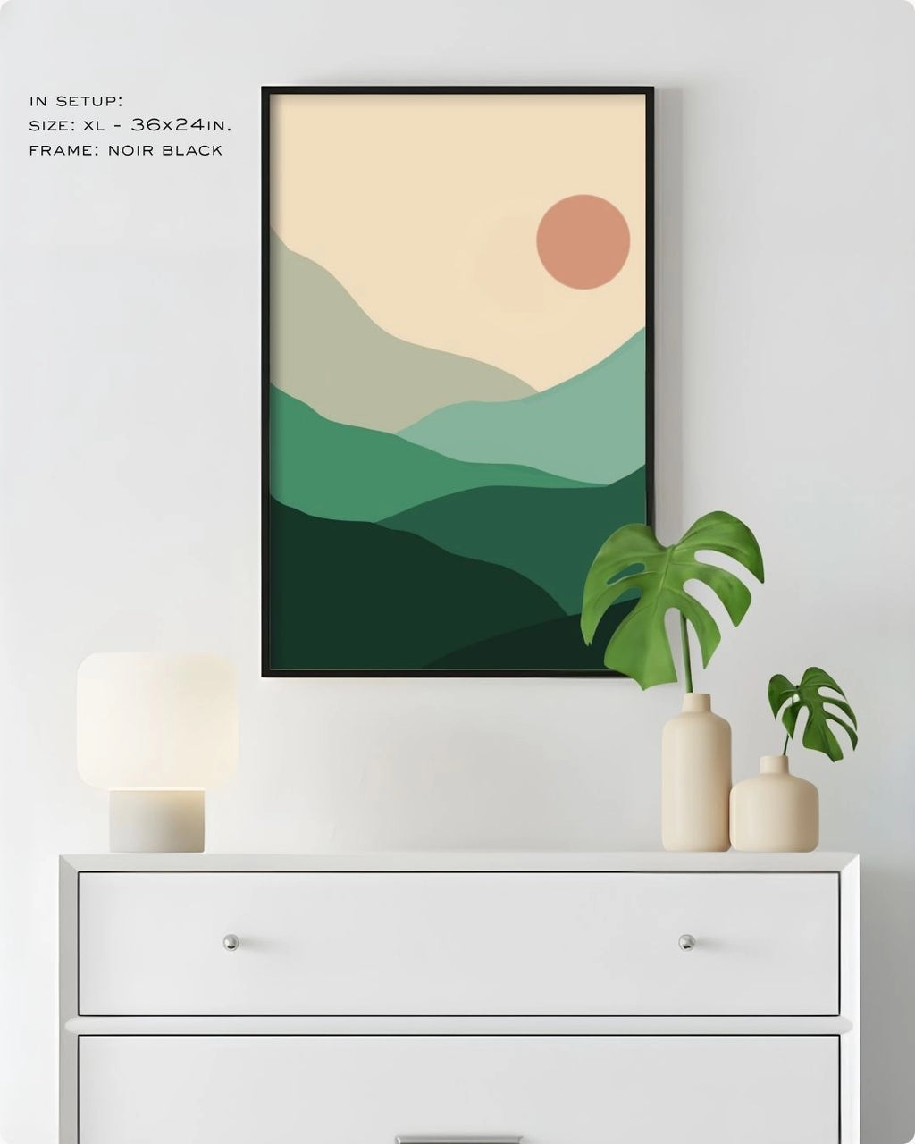 Extra Large (XL) Sage Hills landscape wall art by K2C Co. in a Noir Black frame, hanging above a white dresser in a clean bedroom mockup with a Monstera plant.