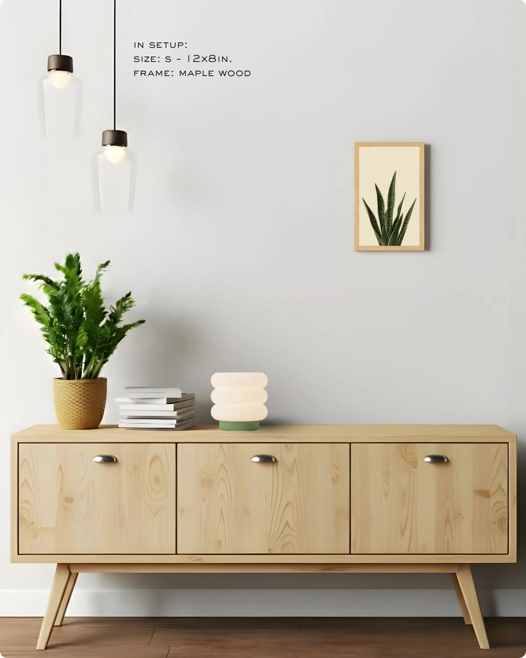 Small (Size S) snake plant botanical art in a Maple Wood frame by K2C Co., demonstrating small-space styling on a minimalist wall.