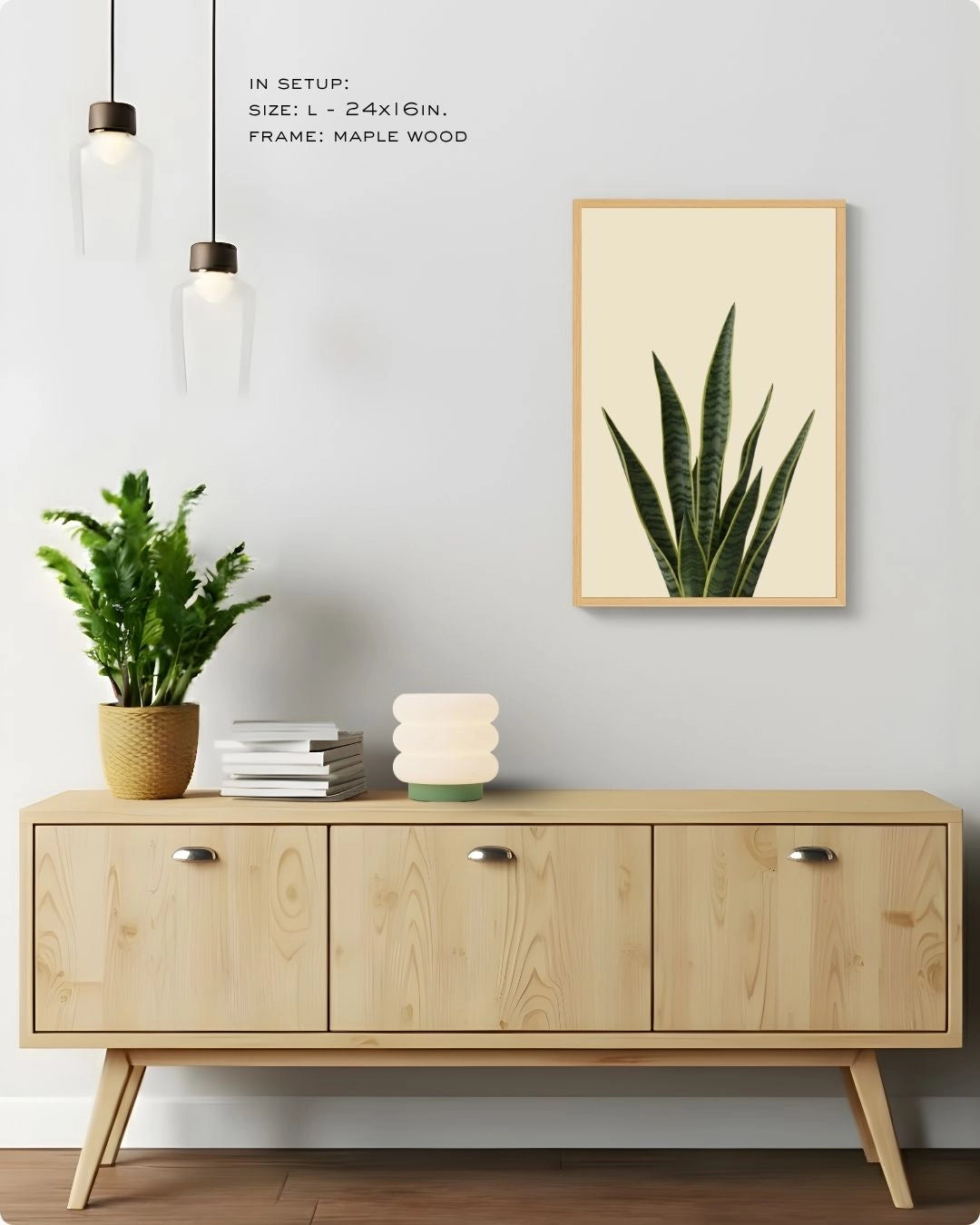 Large (Size L) snake plant wall art in a Maple Wood frame by K2C Co., styled above a modern sideboard with pendant lights.