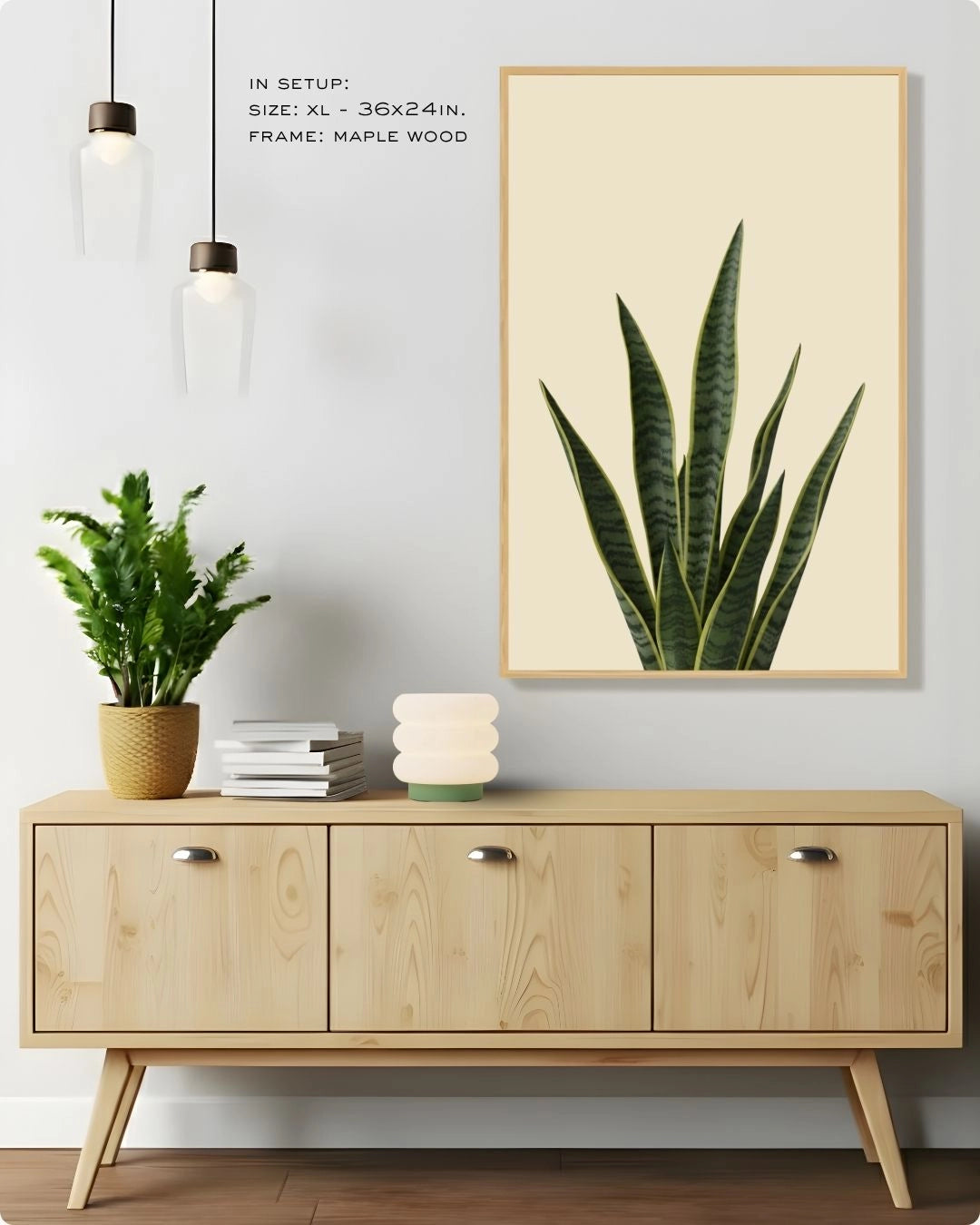 Extra Large (XL) snake plant botanical print by K2C Co. in a Maple Wood frame, hanging in a bright minimalist living room.