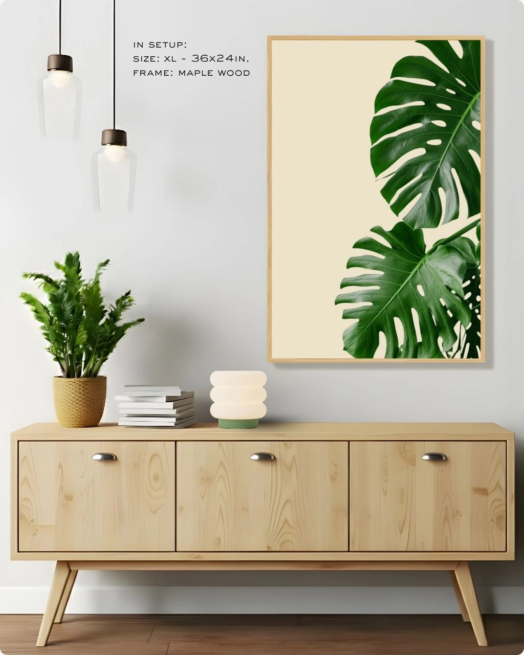 Large-scale tropical banana leaf botanical art by K2C Co. in a Maple Wood frame, hanging above a light wood sideboard in a bright, modern Japandi-style living room.