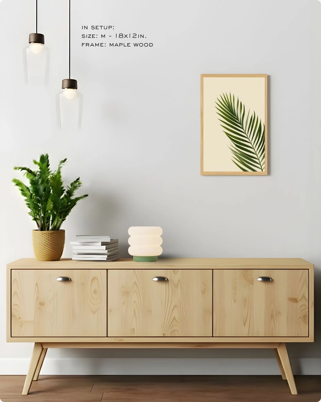 Medium-sized tropical botanical print by K2C Co. in a Maple Wood frame, displayed in a clean living room setting to showcase versatile wall decor scaling.